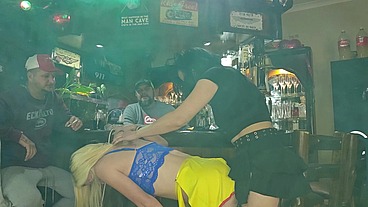 Girls fucking each other with a strapless dildo while husbands watch