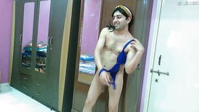 Hot sissy crossdresser femboy in beach dress and hairband.