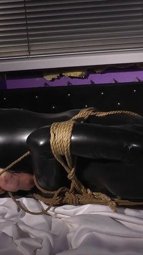 Roped in Latex: Zeus Struggles to Break Free