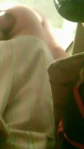 A Young Guy Is Sitting on a Chair with Anal Prolapse