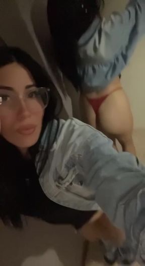 Woman in blue denim jacket taking selfie