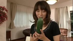 Japanese m. masturbating with a big cucumber