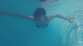 Swimming and masturbating in the pool