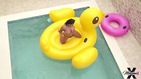 Maxine X, the sexy MILF, lounges in a pool showing off her big natural