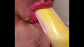 Sucking banana penis toy