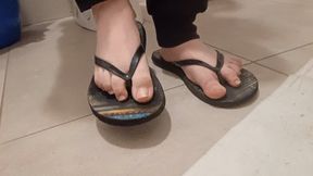 sweaty and dirty feet in flip flops