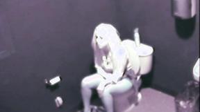 ”Sexy Blonde fingering her cunt public toilet”