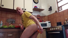 In the kitchen cooking salad I put the carrot in the ass