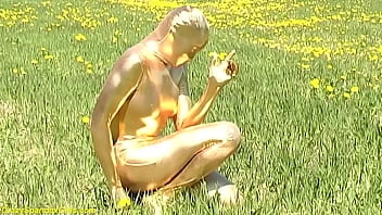 ebony babe in skintight golden spandex catsuit posing outdoor