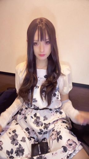 A video of a curly-haired crossdresser quietly masturbating.