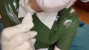 Nurse tries on herself a new pair of white latex gloves with a vibrator