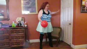 Nurse Vicki  plays with a rubber ball in a mini skirt, sexy stockings and high heel mini boots