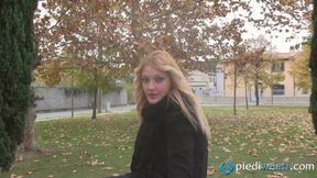 Beautiful blonde smoker showing her feet outdoors