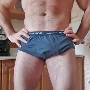 Handsome muscular hairy guy jerks off his huge dick at home