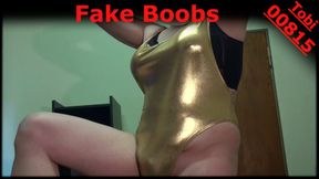 Fake Boobs - some posing in shiny gold swimsuit, shaved body