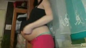 Pregnant brunette teases me with her nice body in webcam chat