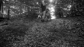 Naked submissive slut taken for a walk on a leash in forest