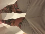 Tattooed guy wetting boxers