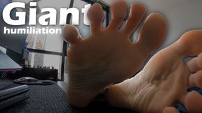 Giant humiliates and ignores human who watches his feet