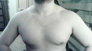 Bulky camboy ripples his muscled torso and palms
