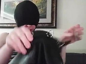 Trying on a latex hood