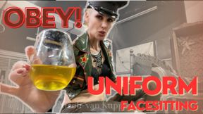 Latex Uniform face sitting - Mistress Nicole in military uniform with peaked cap and black high heels boots