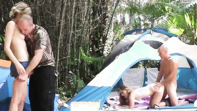Some young couples on a camping trip having a nice outdoors party getting slammed and swapping partners