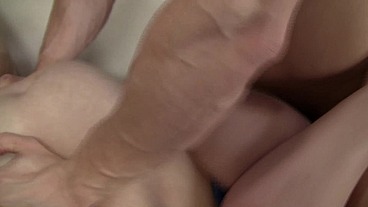 Watch as she lays back and gets smacked in the face by her own massive tits, while her man...