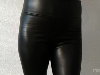 Headmistress shows her taut legs and nice-looking booty in ebony leather panties