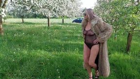 Mature woman parades in see-through bodysuit and heels