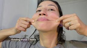 Holding Puffy Cheeks and Red Face