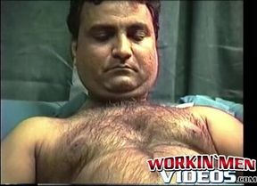 Hairy mature amateur Shawn solo plays with his cock on a bed