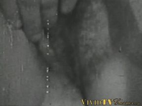 Black and white vintage video of lady sucking her lover