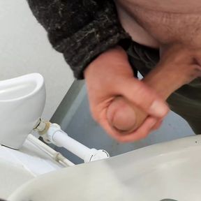 Public urinal masturbation