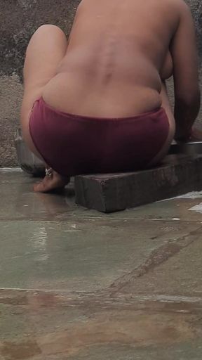 Unforgettable moment from &quot;Desi Indian village bathroom in open courtyard wearing red tights bathing&quot;