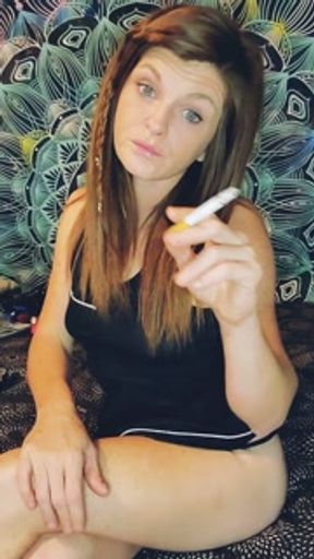 Sexy redhead smoking and showing off perfect tits