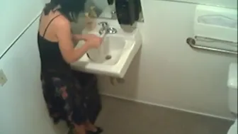 Amateur girl indulges in kinky pissing fetish in restroom