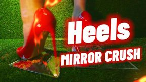Breaking mirror with her heels