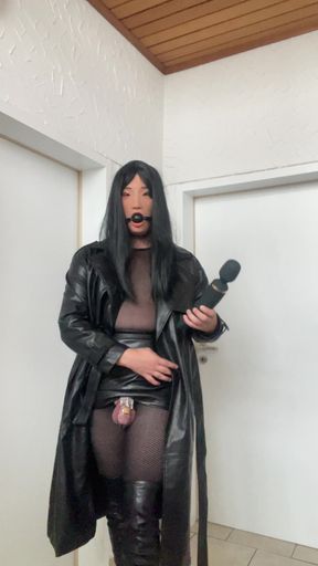 ball gagged crossdresser sissy in chastity and leather teasing her locked clitty