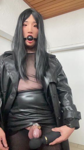 ball gagged crossdresser sissy in chastity and leather teasing her locked clitty