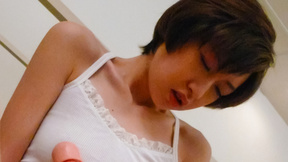 Short-haired Japanese woman Akina Hara tests her new realistic dildo