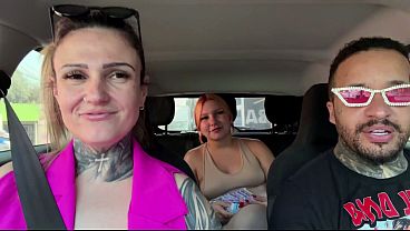 Young redhead gets a sweet treat in the car