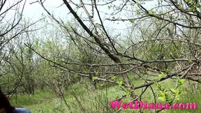 Pissing in the grass with legs wide opened and wipe her pussy with a leaf