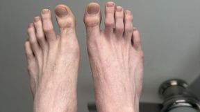 Exposed sissy washes big stinky feet completely naked