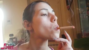 Tempting Italian girl smokes a cigar in a close up video