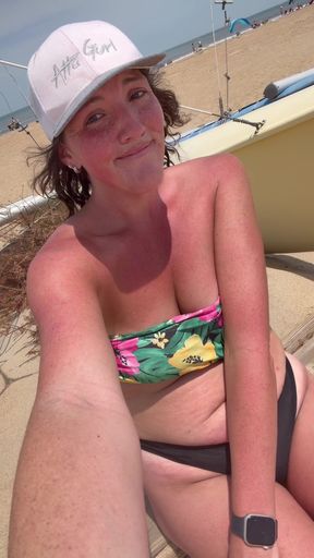 Naughty beach babe pisses in public