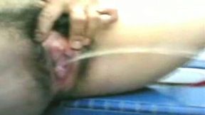 Malay young wife with big tits and furry poontang on cam