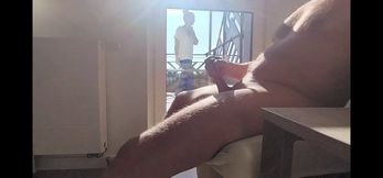 dickflash in a hotel where a maid comes through the balcony and gets cum on her tits