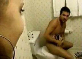 Kinky Indian slut finds a guy wanking in the bathroom so she helps him out with stout blowjob