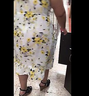 Floral MILF caught on voyeur cam at supermarket